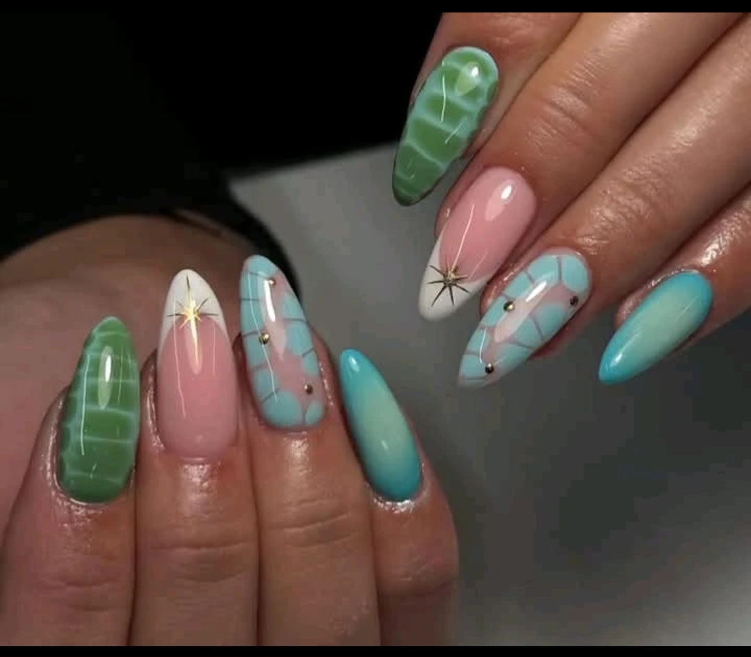 Pastel almond nails with gold stars